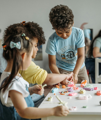Kids playing with clay together