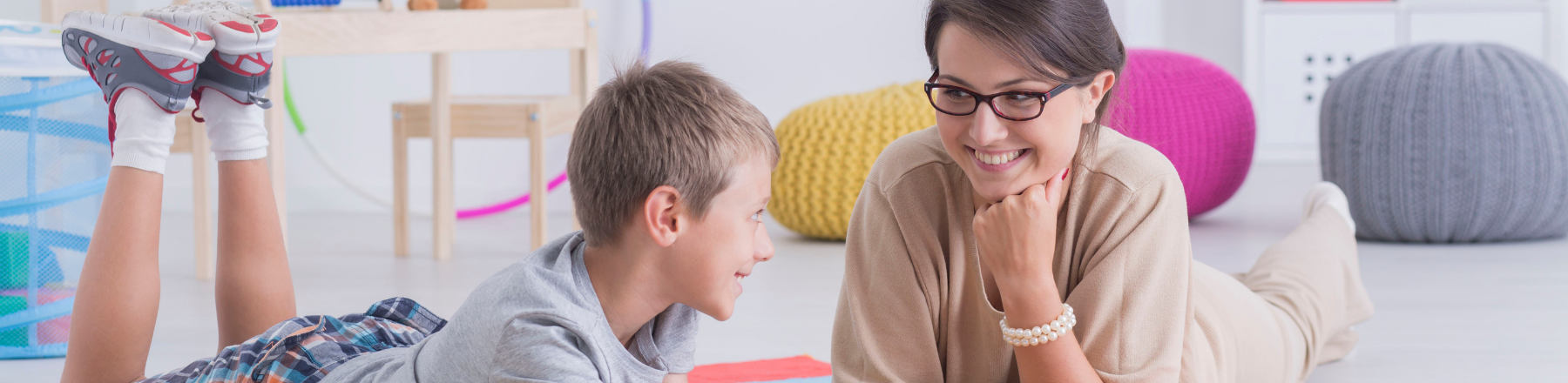 Therapist connecting with a child during play