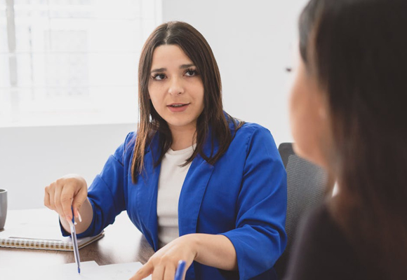 Professionals discussing paperwork in a meeting